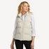 Front view of women’s navy and cream waterproof puffer vest zipped on model – Louvóre apparel